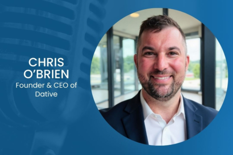 Portrait of Chris O'Brien, Founder & CEO of Dative, smiling in a navy blazer and white shirt inside a circular photo on a blue background.
