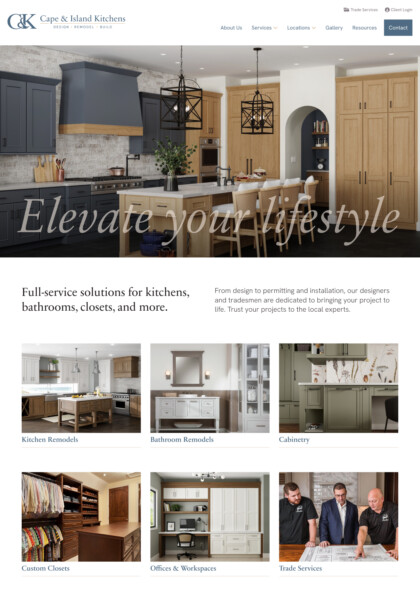 Large modern kitchen with navy cabinets, wood range hood, island, and pendant lighting; text overlay “Elevate your lifestyle” across the scene.